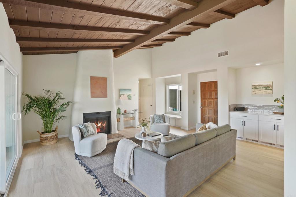 1126 Hermosillo Glen Escondido, CA 92026 - Photo 5 of 32 a living room with furniture and a fireplace