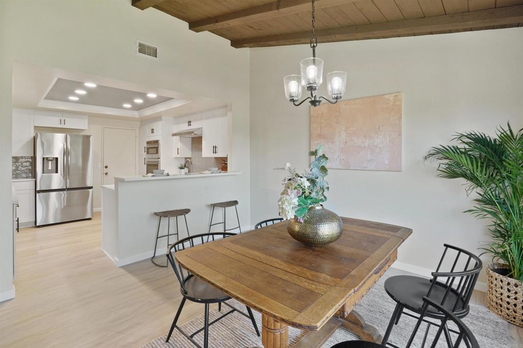 1126 Hermosillo Glen Escondido, CA 92026 - Photo 7 of 32 a view of a dining room with furniture and chandelier