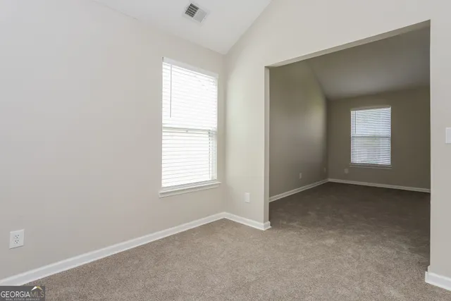 an empty room with windows