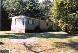 10986 Harry Riggin Road Princess Anne, MD 21853 - Photo 1 of 1 a view of backyard of house and trees