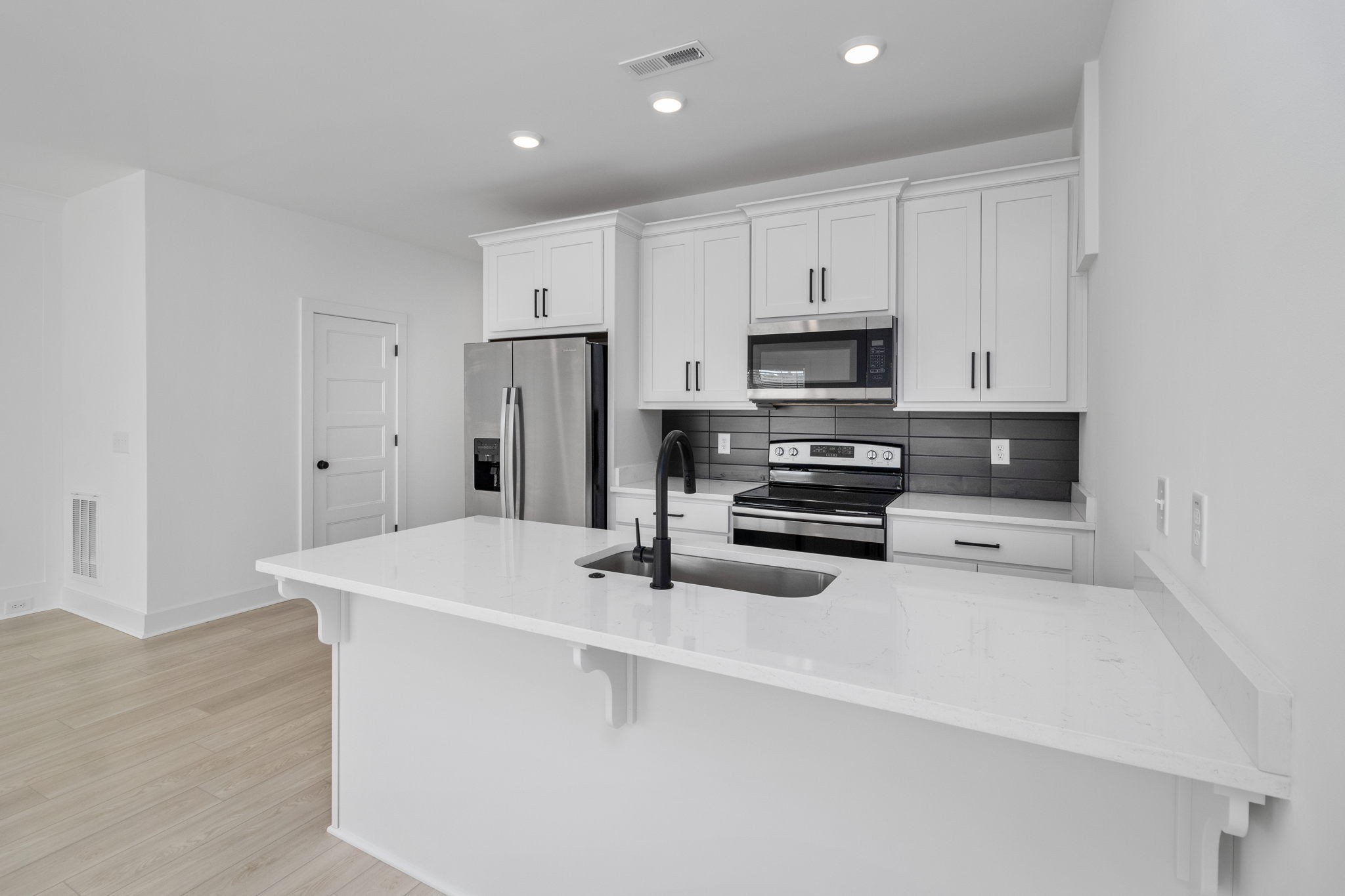 725 Hornbuckle Road, Unit O3 Clarksville, TN 37043 - Photo 5 of 38 a kitchen with stainless steel appliances a stove a sink a microwave and a refrigerator