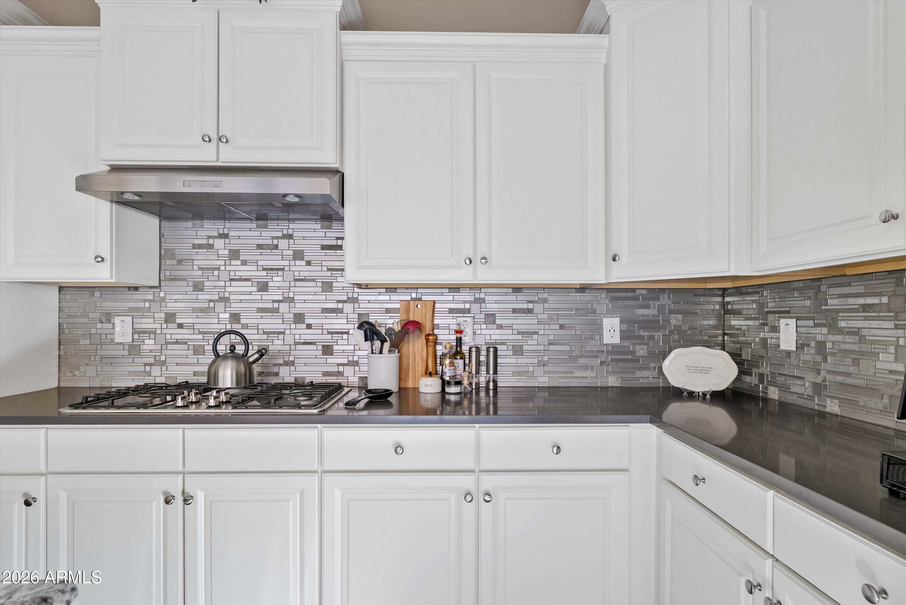 4461 East Jones Street Gilbert, AZ 85295 - Photo 12 of 40 a kitchen with white cabinets and sink