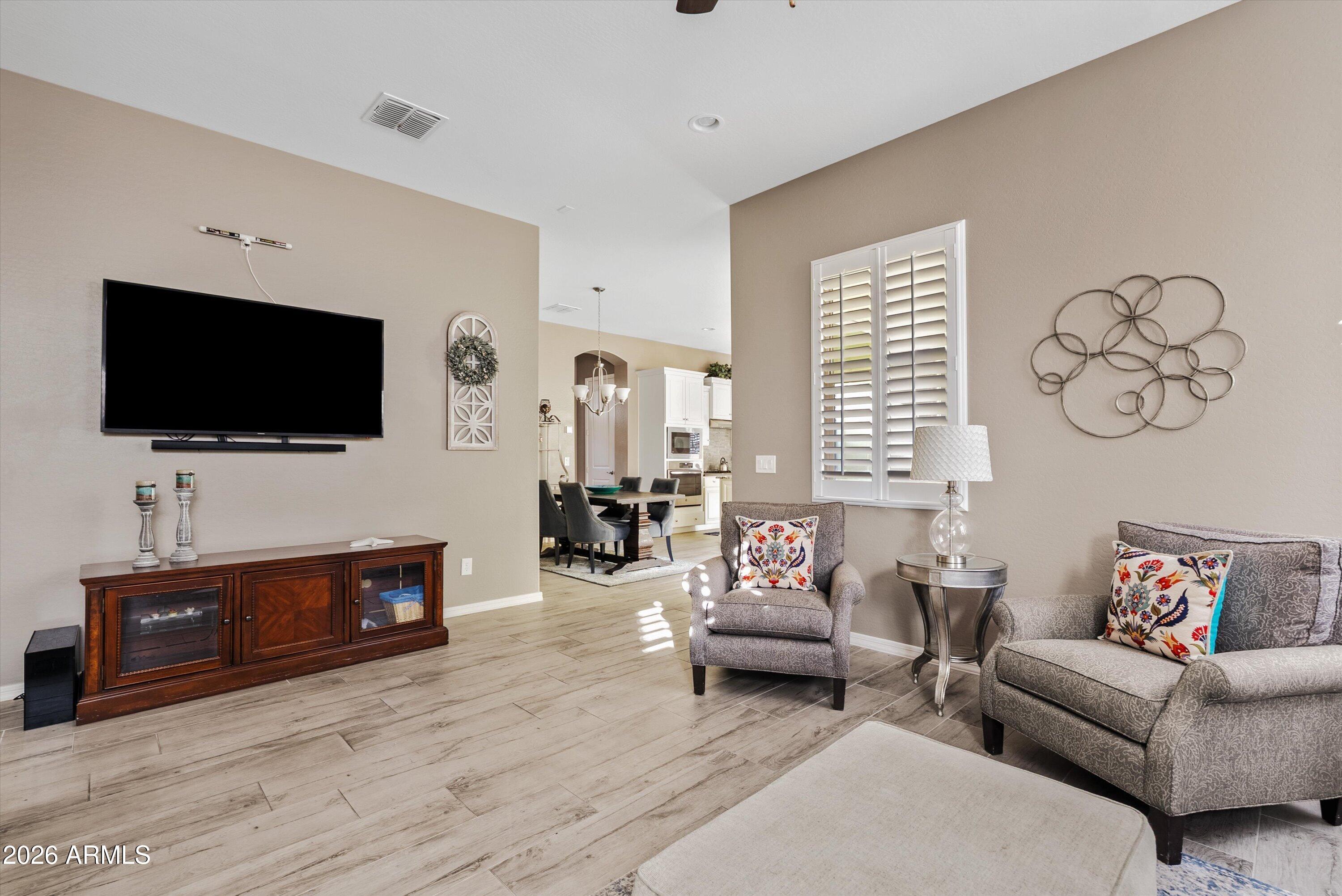 4461 East Jones Street Gilbert, AZ 85295 - Photo 20 of 40 a living room with furniture and a flat screen tv
