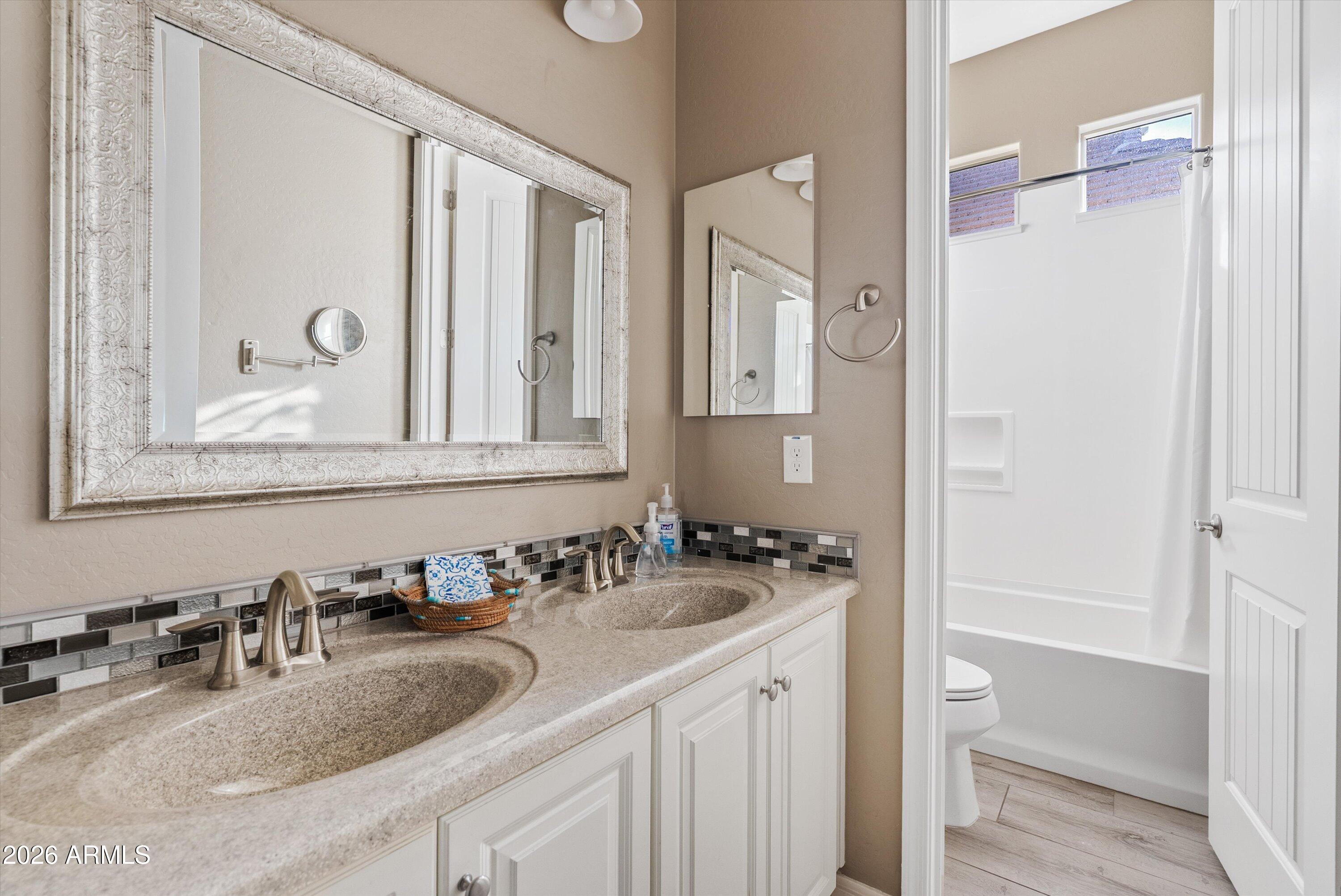 4461 East Jones Street Gilbert, AZ 85295 - Photo 22 of 40 a bathroom with a sink and a mirror