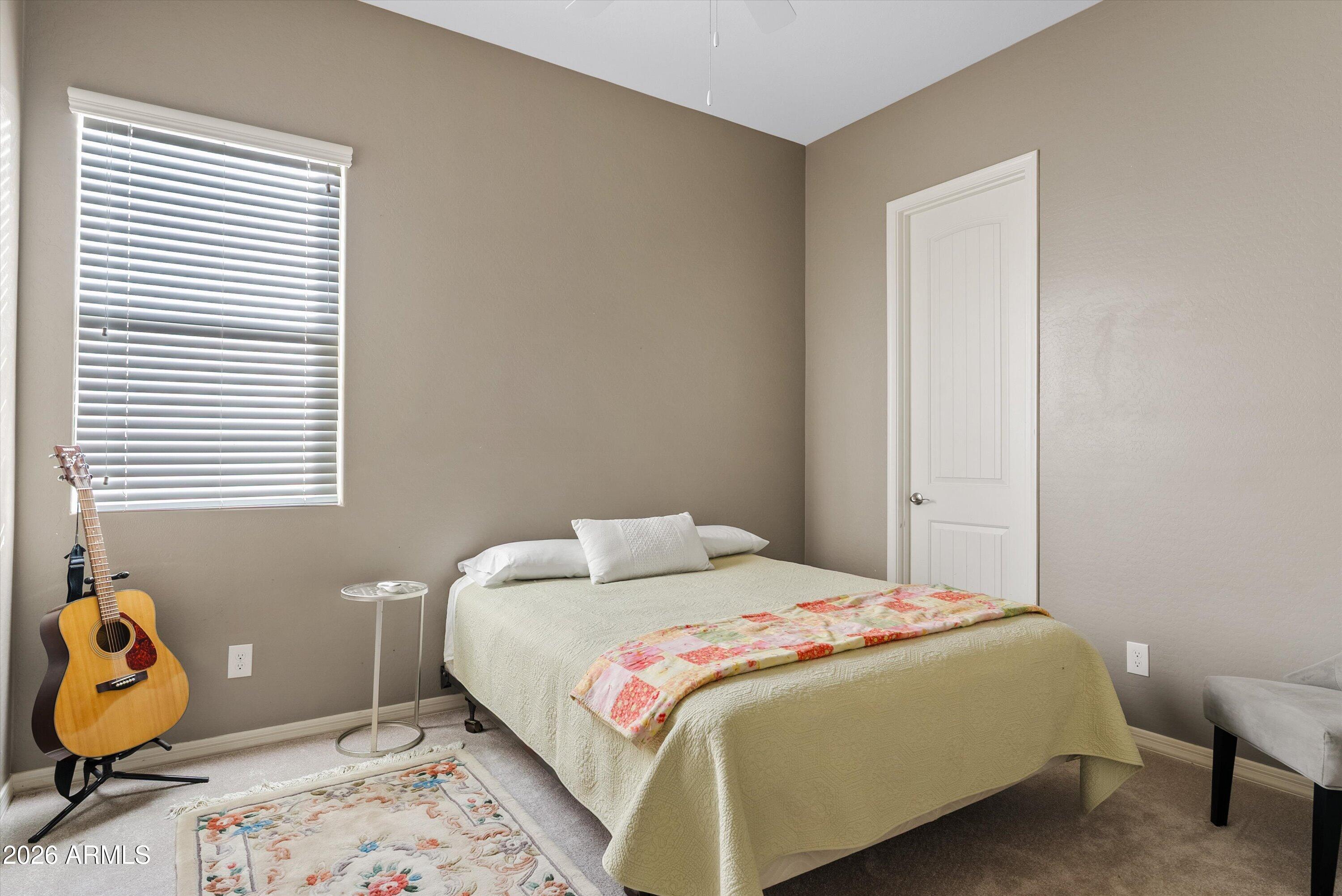 4461 East Jones Street Gilbert, AZ 85295 - Photo 23 of 40 a bedroom with a bed and a window