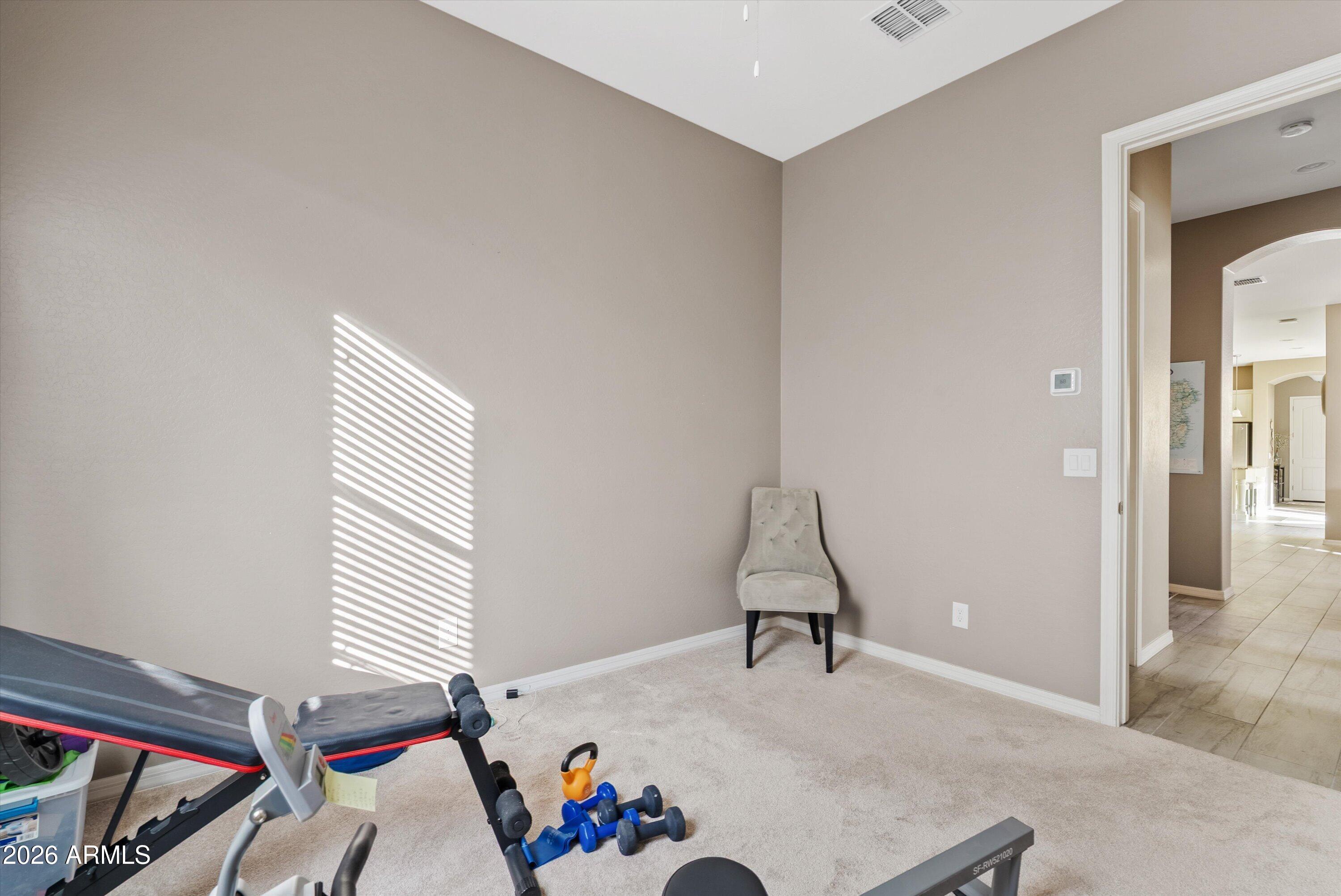 4461 East Jones Street Gilbert, AZ 85295 - Photo 26 of 40 a bedroom with furniture and a window