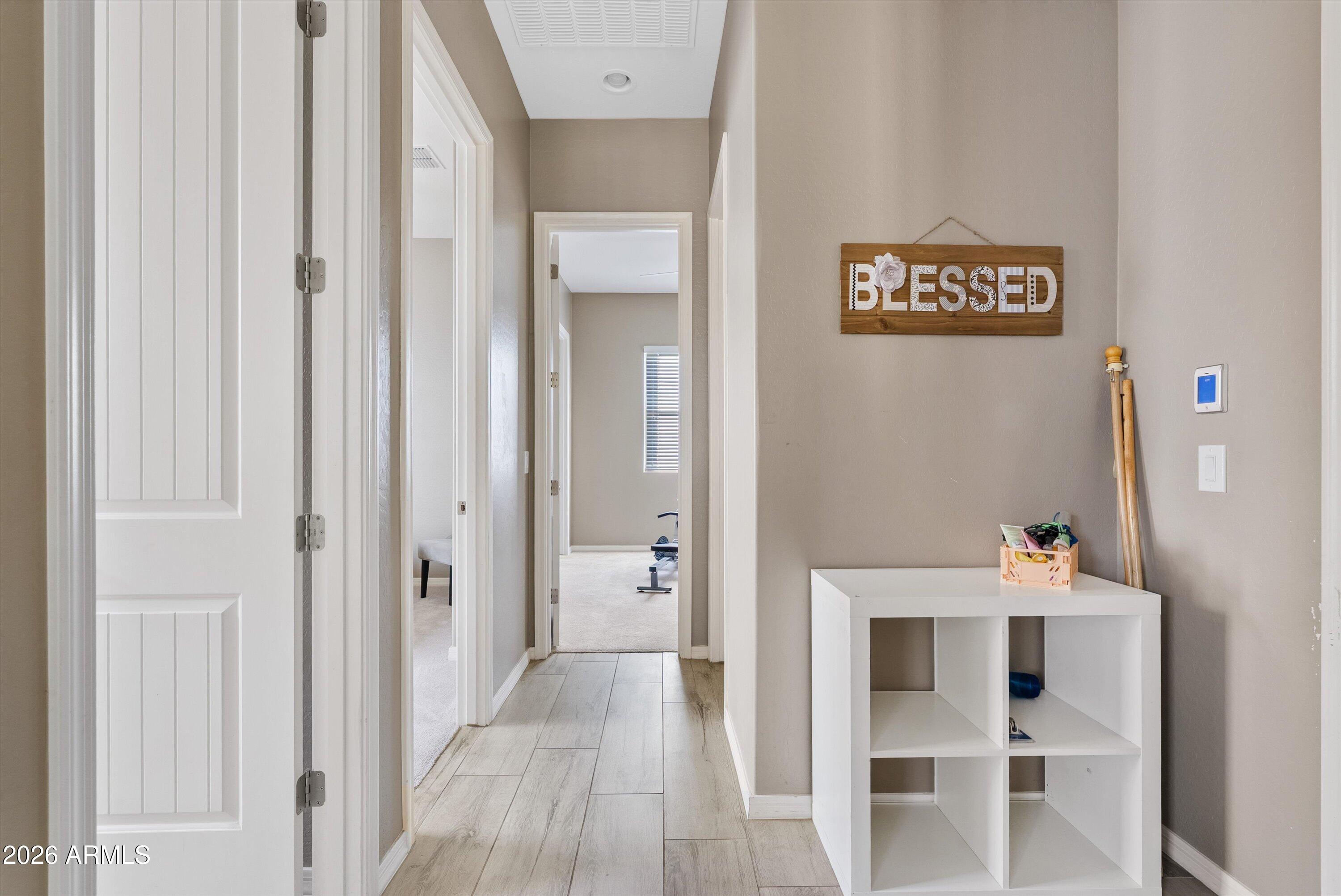 4461 East Jones Street Gilbert, AZ 85295 - Photo 27 of 40 a workspace with furniture and wooden floor