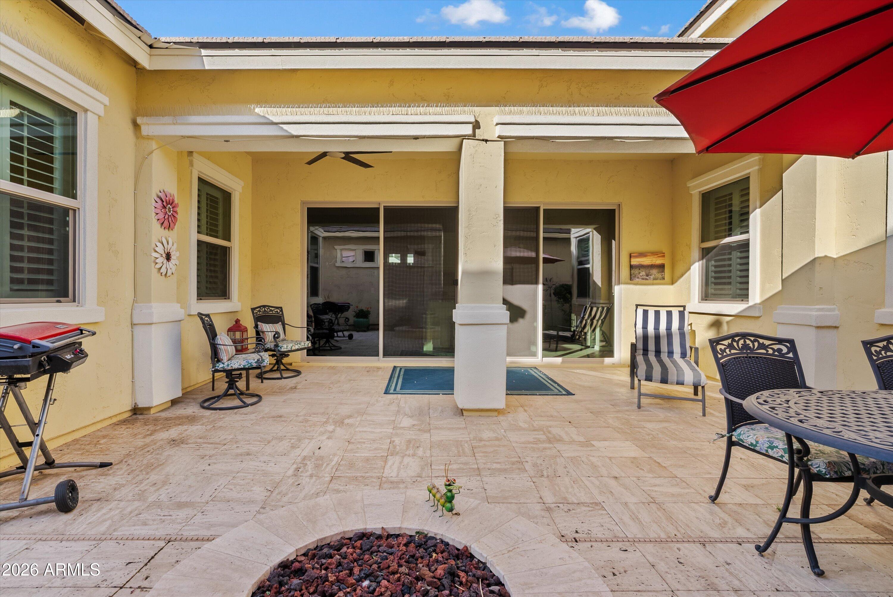 4461 East Jones Street Gilbert, AZ 85295 - Photo 30 of 40 a view of a patio with a table and chairs