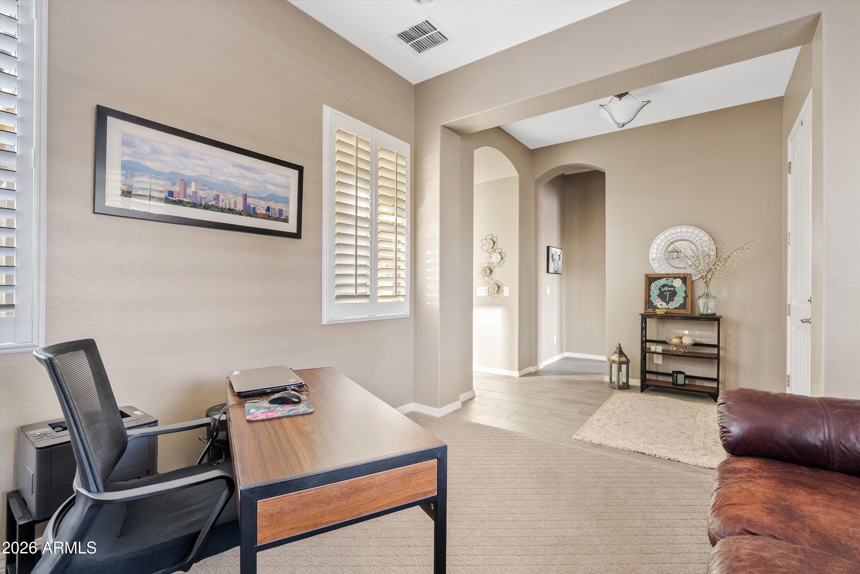 4461 East Jones Street Gilbert, AZ 85295 - Photo 3 of 40 a living room with furniture and a window