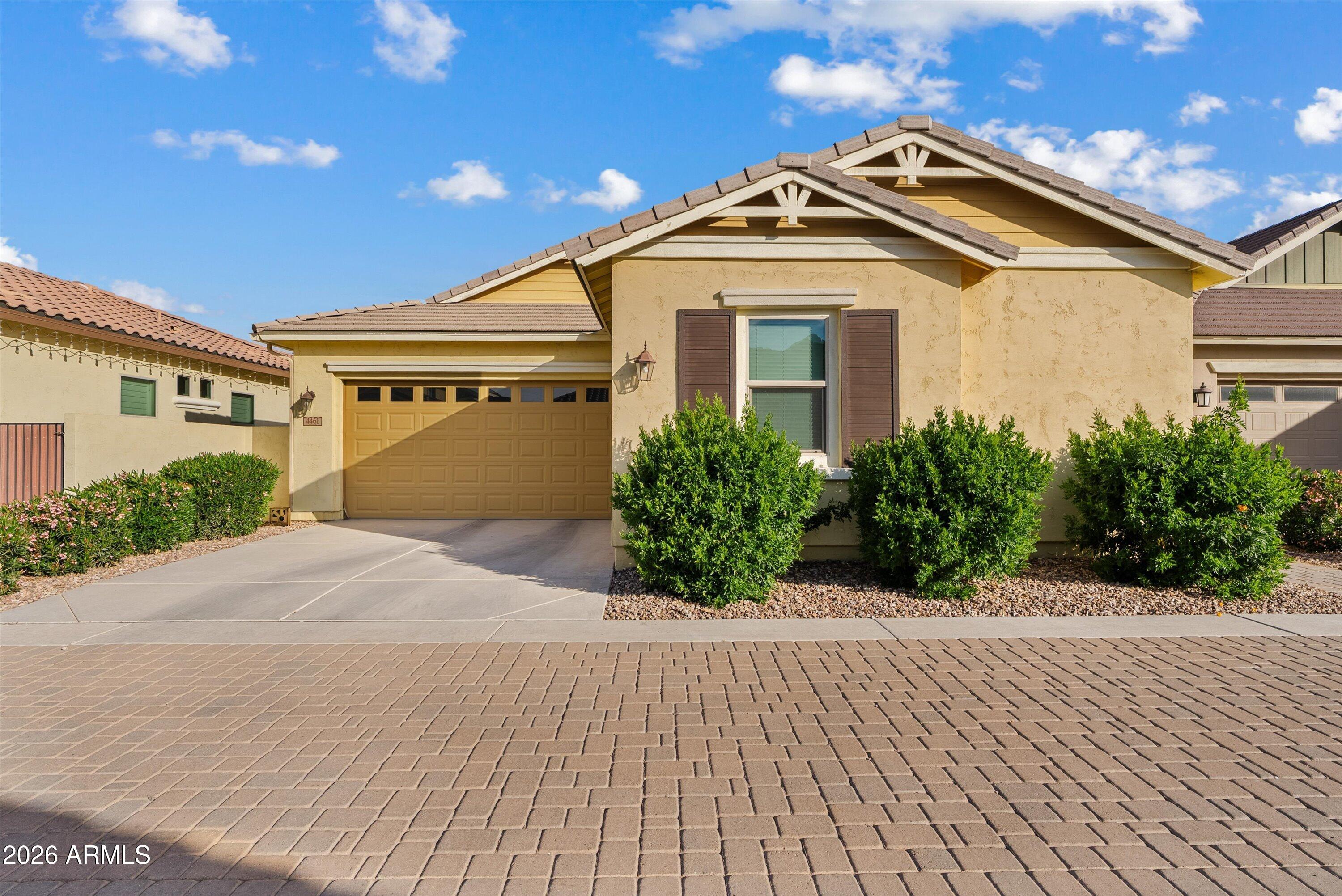 4461 East Jones Street Gilbert, AZ 85295 - Photo 32 of 40 a front view of a house with a yard