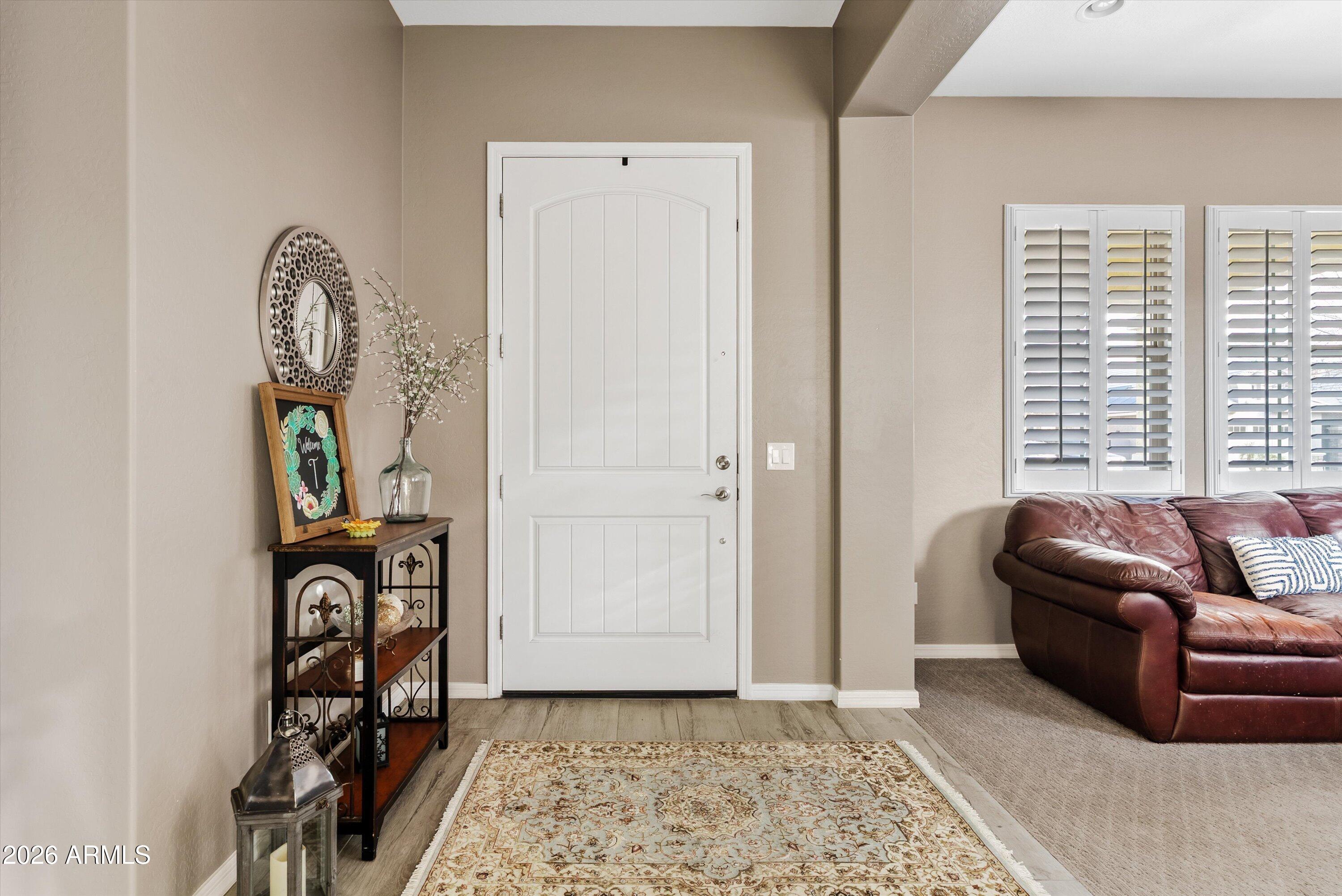 4461 East Jones Street Gilbert, AZ 85295 - Photo 4 of 40 a living room with furniture and a window