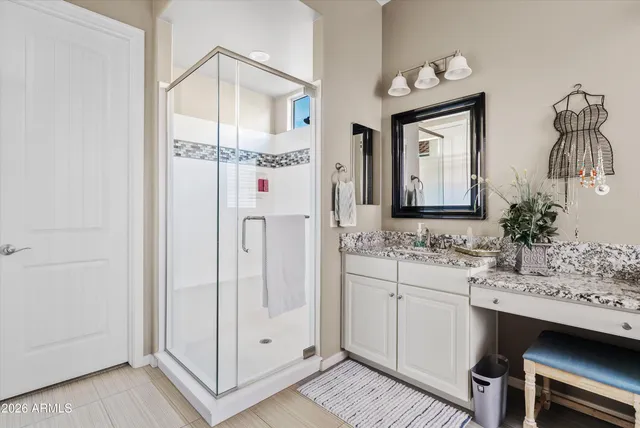 a bathroom with a double vanity sink mirror and