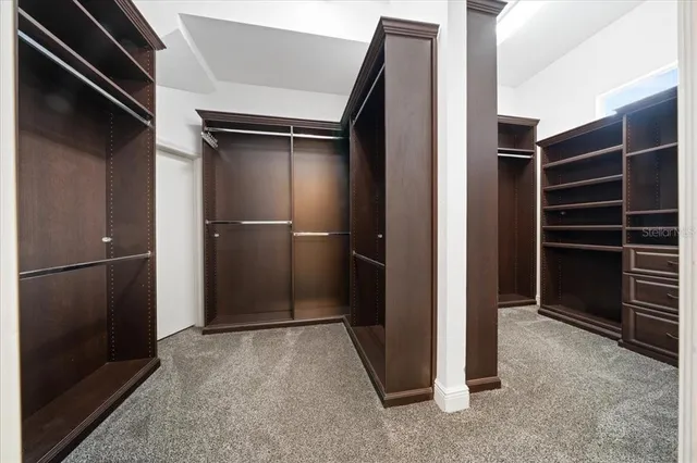 an aerial view of residential houses with outdoor space and street view