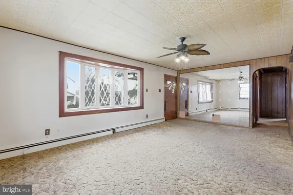 a view of an empty room with a window