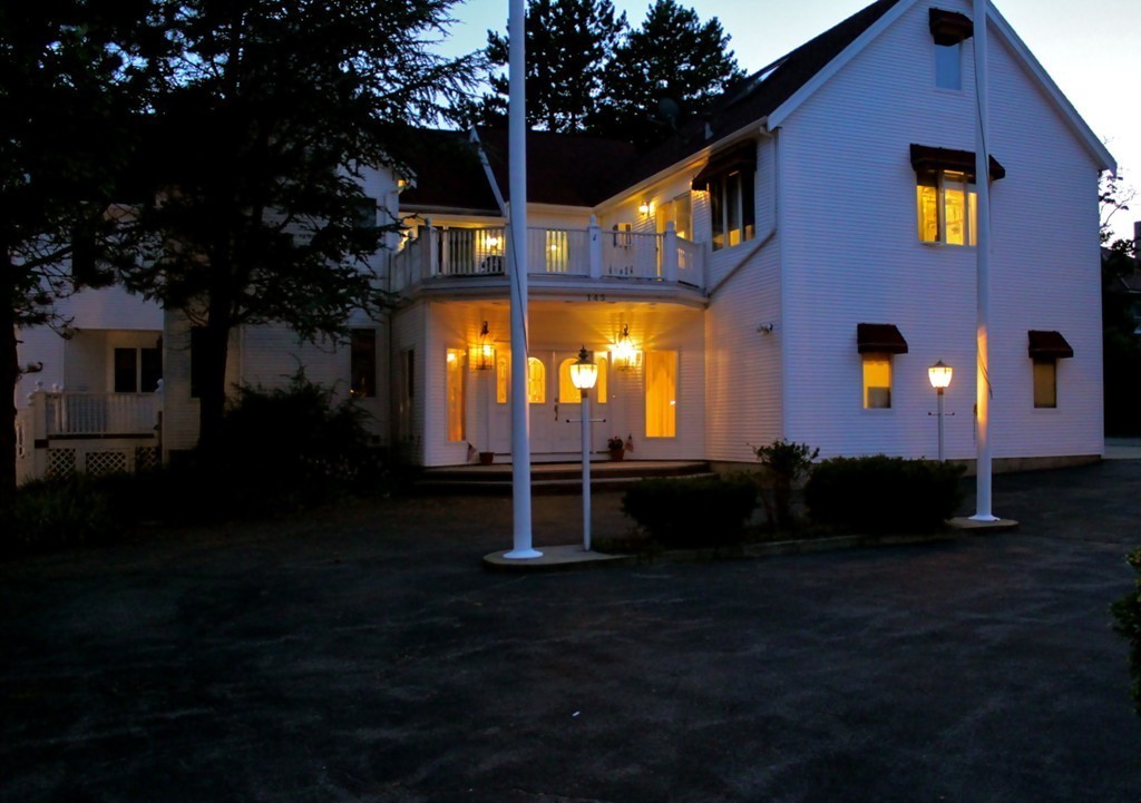 145 Puritan Road Swampscott, MA 01907 - Photo 14 of 19 a front view of a house with a garden