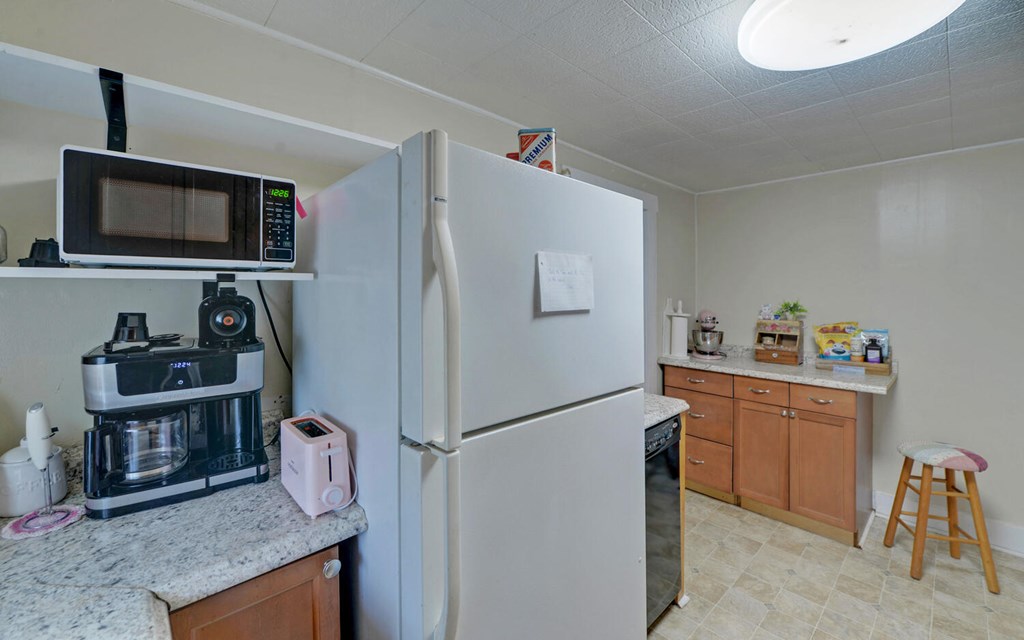 335 Elliott Road Murphy, NC 28906 - Photo 12 of 44 a kitchen with stainless steel appliances granite countertop a refrigerator and a stove top oven