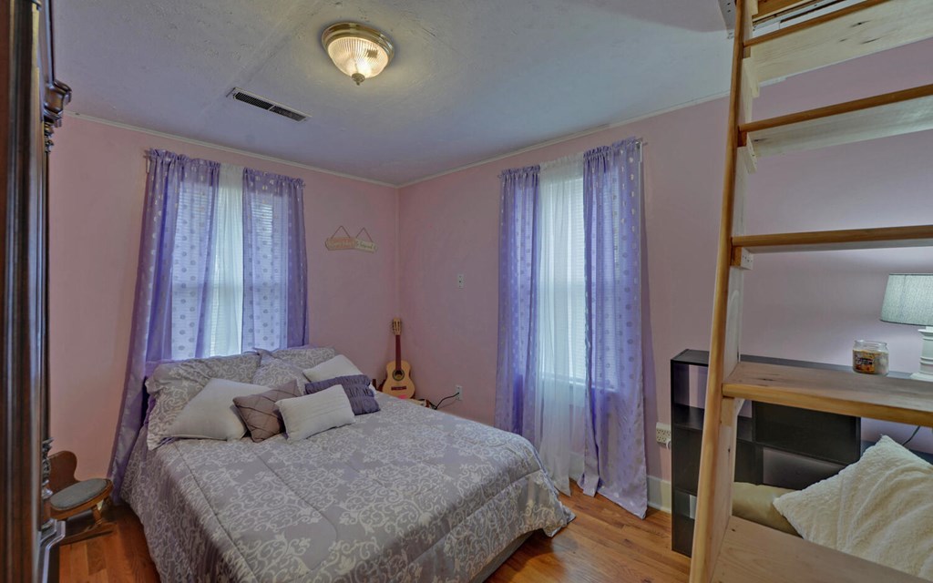 335 Elliott Road Murphy, NC 28906 - Photo 19 of 44 a bedroom with a bed and a mirror