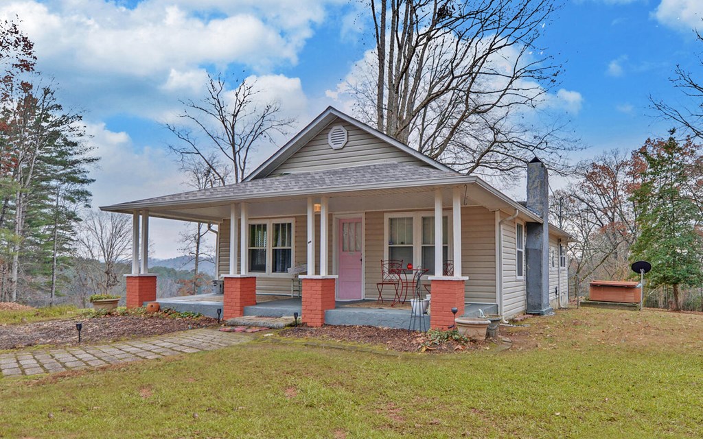 335 Elliott Road Murphy, NC 28906 - Photo 2 of 44 a house view with a sitting space and garden
