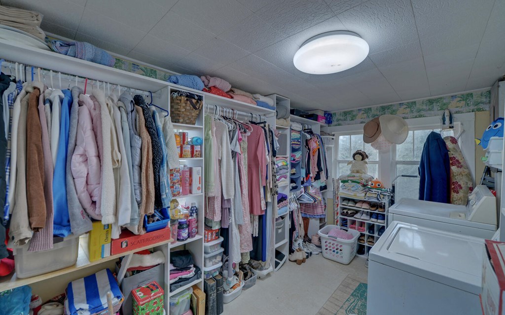 335 Elliott Road Murphy, NC 28906 - Photo 23 of 44 a view of walk in closet with clothes