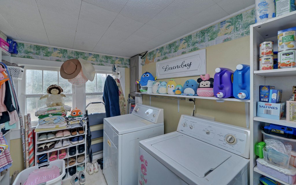 335 Elliott Road Murphy, NC 28906 - Photo 24 of 44 a storage room with washer and dryer