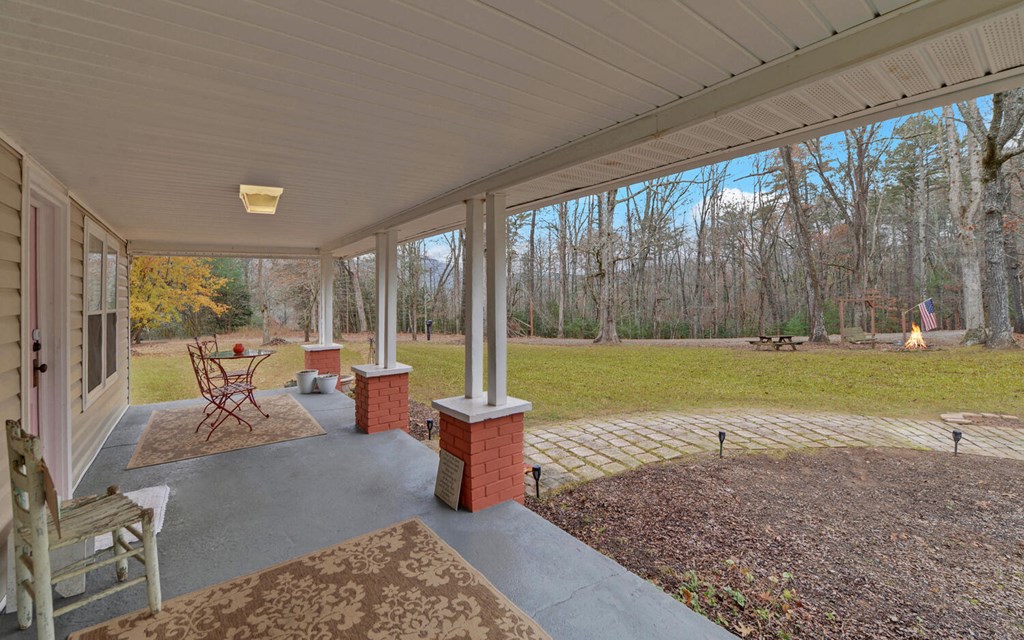 335 Elliott Road Murphy, NC 28906 - Photo 3 of 44 a living room with patio furniture and garden