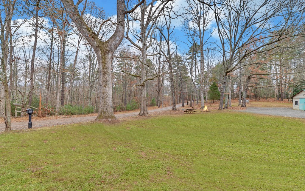 335 Elliott Road Murphy, NC 28906 - Photo 36 of 44 a swimming pool with outdoor seating and yard
