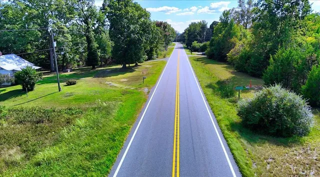 a view of swimming pool with a yard