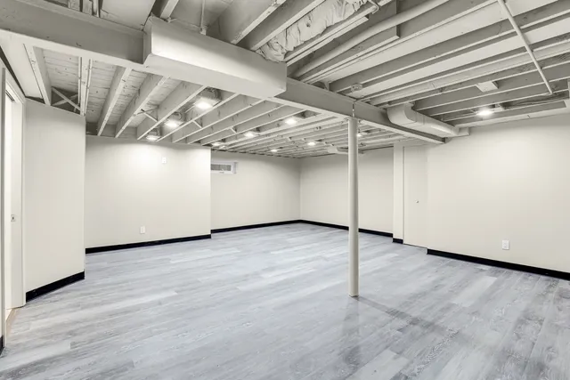 a view of a room with wooden walls