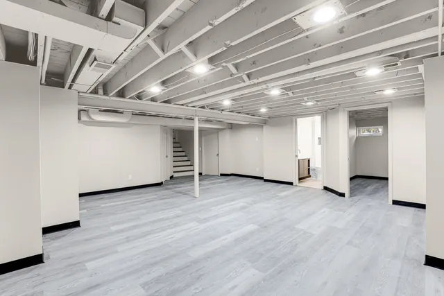 a view of a room with wooden floor