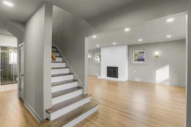 a view of entryway and hall with wooden floor