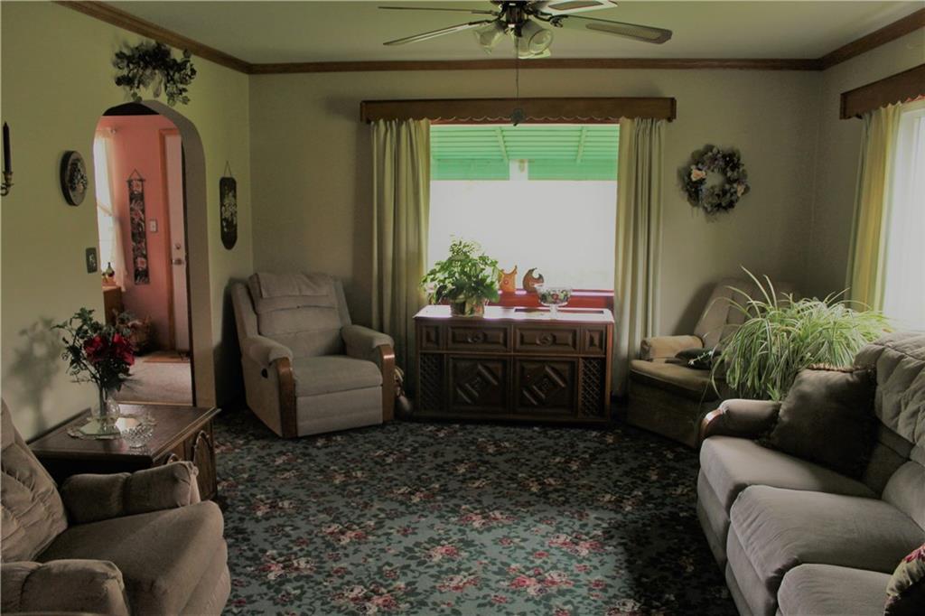 833 Greenville Road Mercer, PA 16137 - Photo 7 of 16 Spacious Living Room with 2 Large Picture Windows and Crown Molding