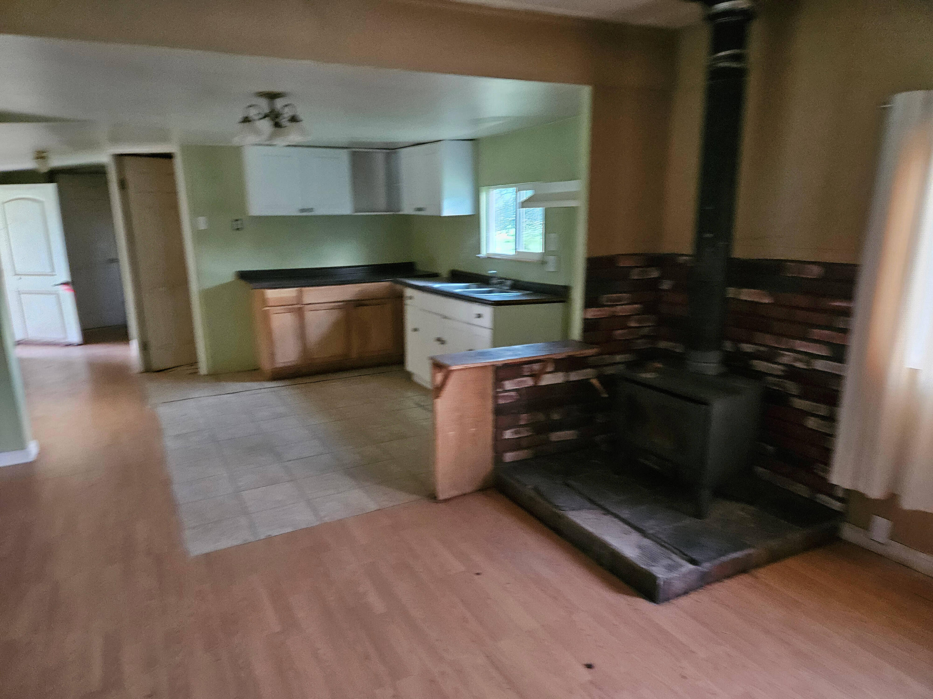 21675 Wildcat Road Shingletown, CA 96088 - Photo 38 of 65 a kitchen with granite countertop a stove and cabinets