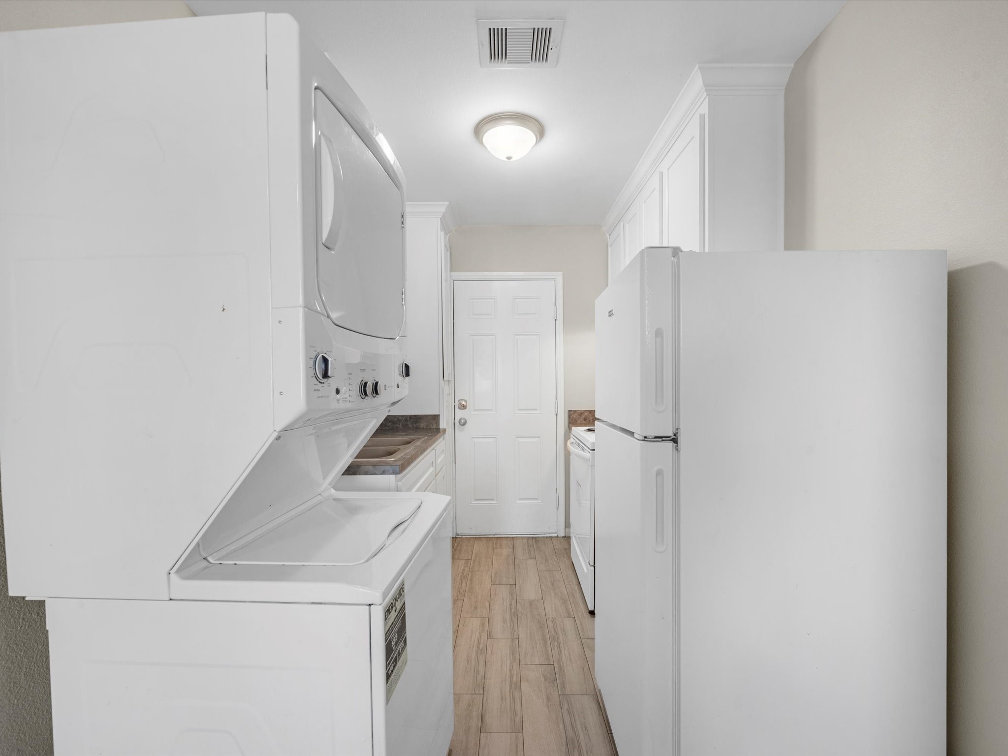 2202 Solo Street, Unit 2204 Houston, TX 77020 - Photo 12 of 21 a kitchen with a sink and refrigerator