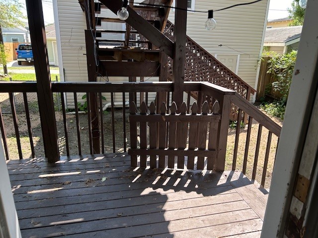 4725 Avenue R 1/2 Galveston, TX 77551 - Photo 15 of 18 a view of a balcony with wooden floor