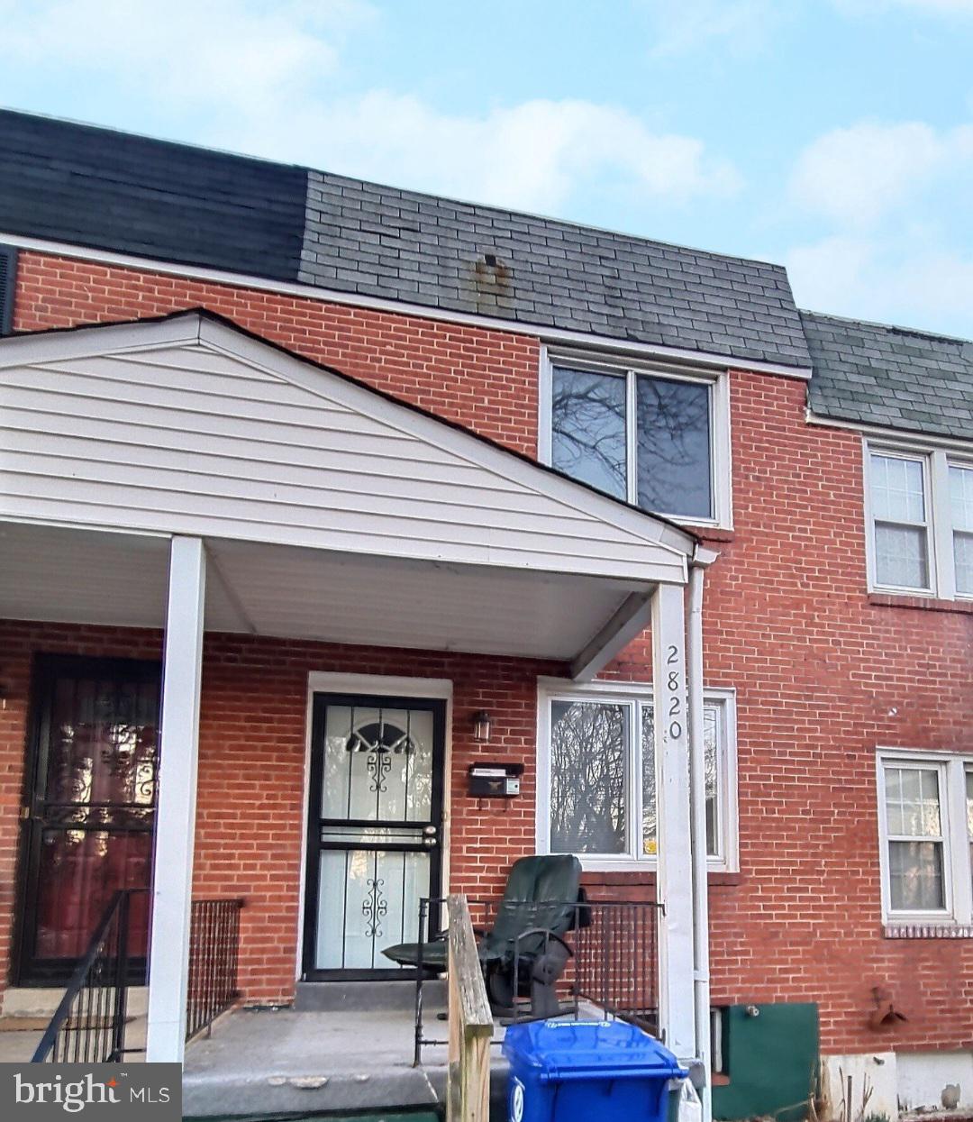 a front view of a building with garage