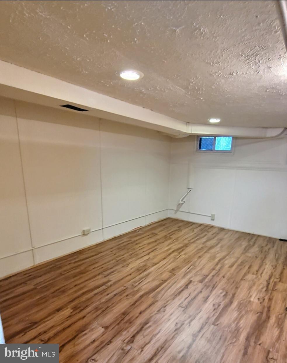 2820 Edgecombe Circle South Baltimore, MD 21215 - Photo 11 of 14 a view of empty room with wooden floor