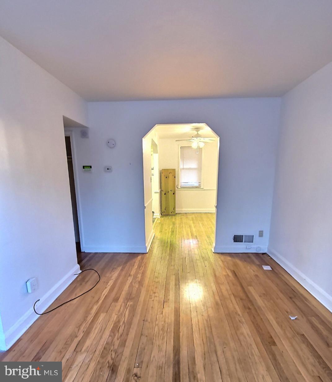 2820 Edgecombe Circle South Baltimore, MD 21215 - Photo 2 of 14 a view of empty room with wooden floor