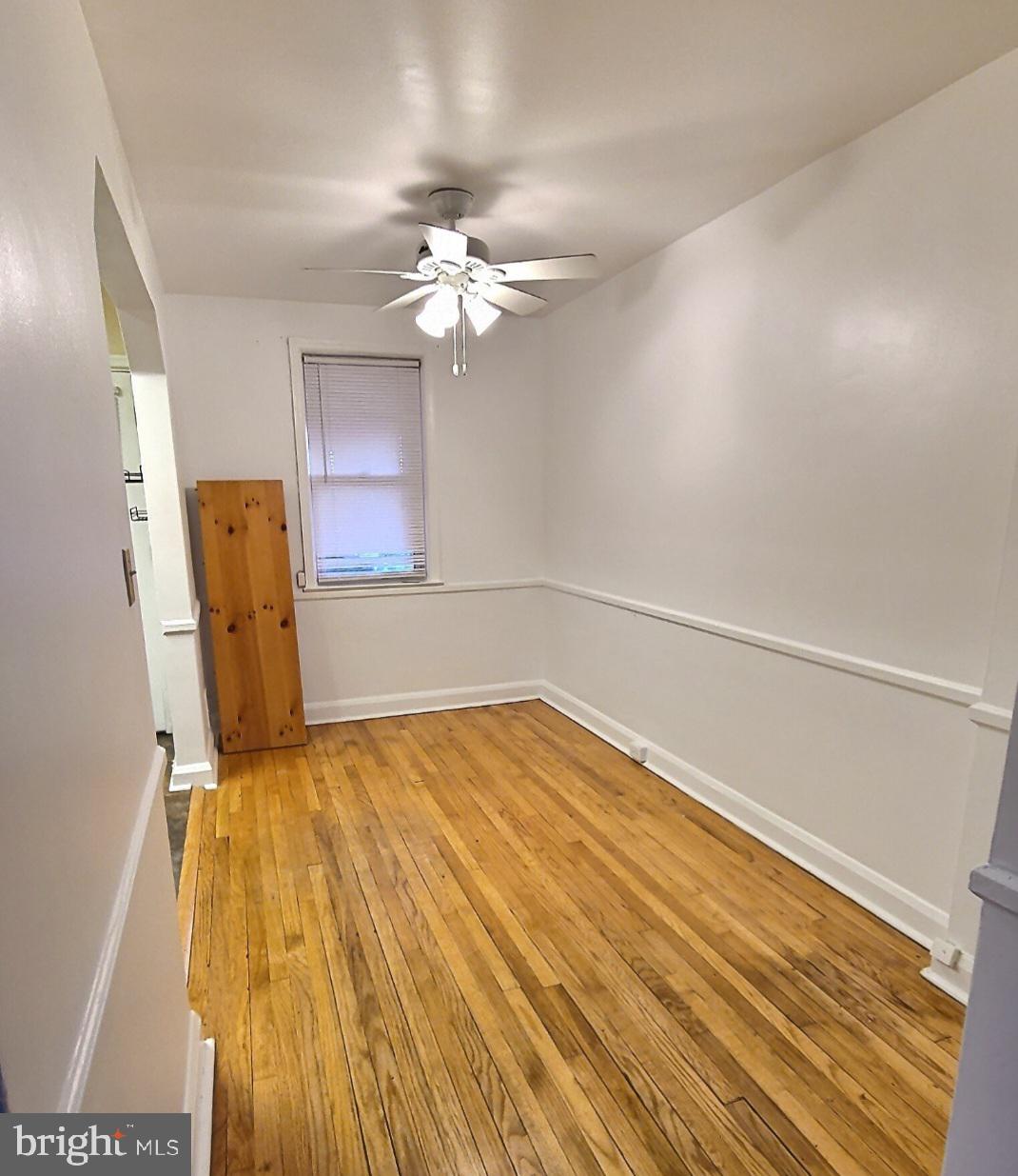 2820 Edgecombe Circle South Baltimore, MD 21215 - Photo 4 of 14 a view of a room with wooden floor and cabinet