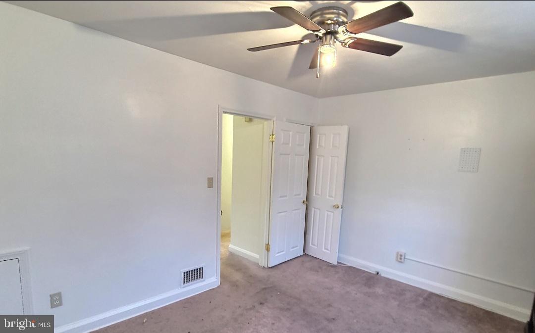 2820 Edgecombe Circle South Baltimore, MD 21215 - Photo 6 of 14 wooden floor in an empty room