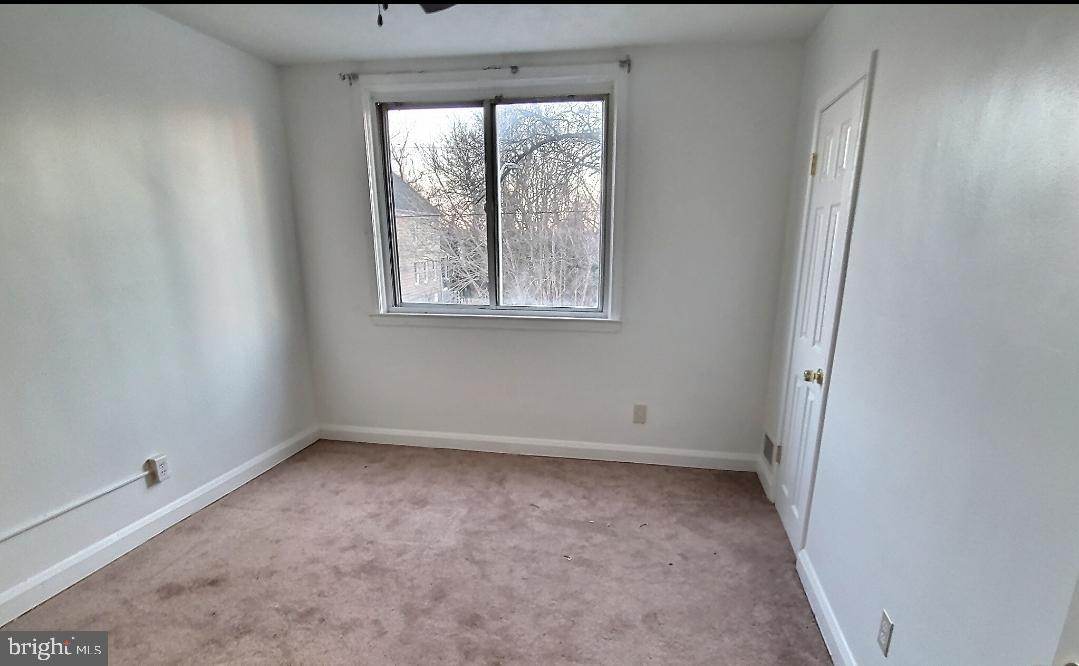 2820 Edgecombe Circle South Baltimore, MD 21215 - Photo 7 of 14 an empty room with a window