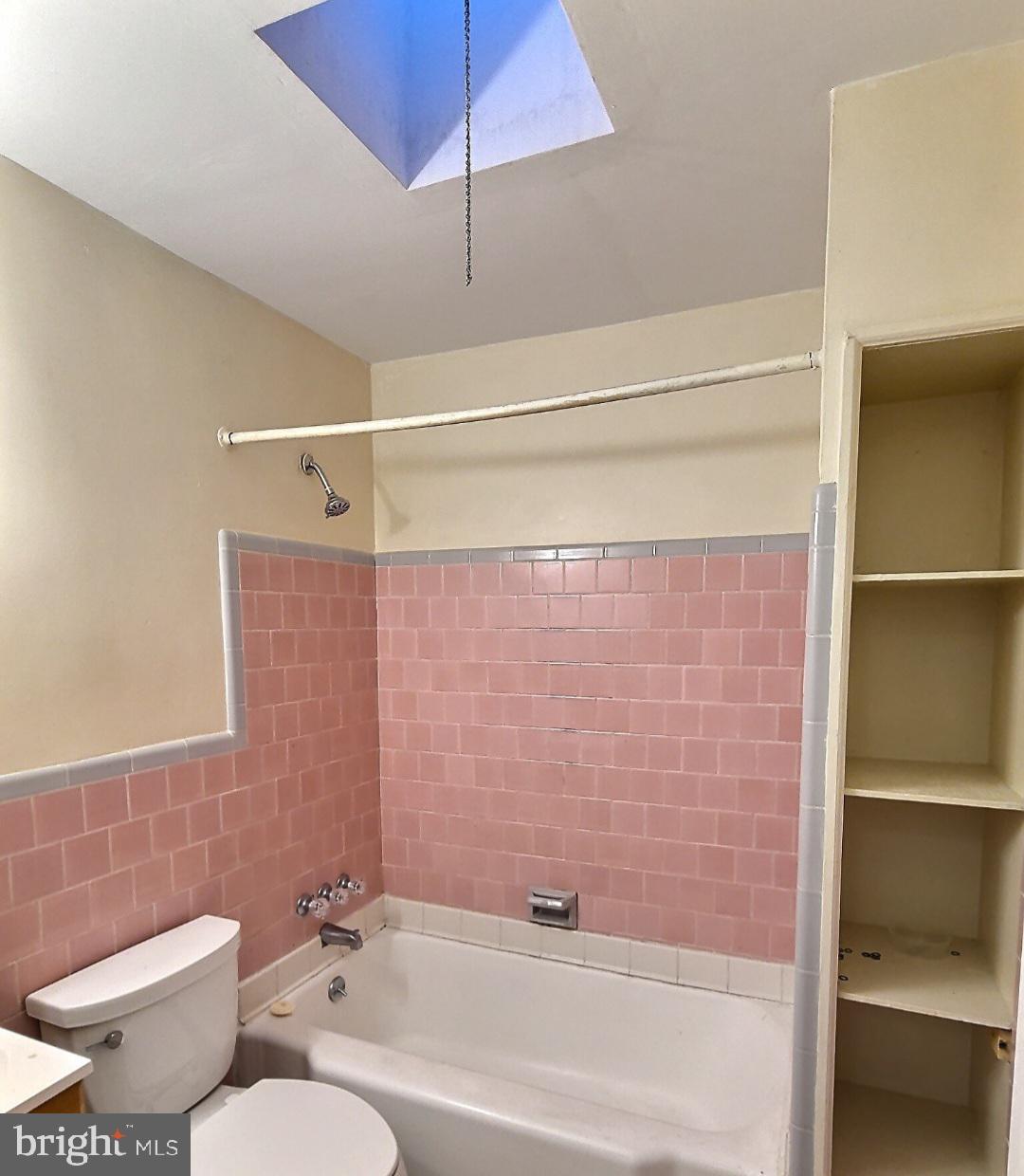 2820 Edgecombe Circle South Baltimore, MD 21215 - Photo 9 of 14 a bathroom with a toilet and a shower