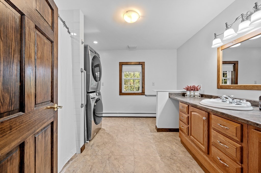 46 Farm Road Bolton, MA 01740 - Photo 21 of 41 a bathroom with a sink a vanity and a mirror
