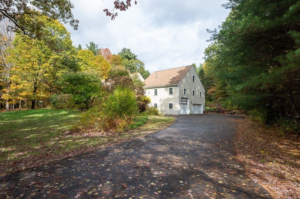46 Farm Road Bolton, MA 01740 - Photo 34 of 41 a view of a house with a yard