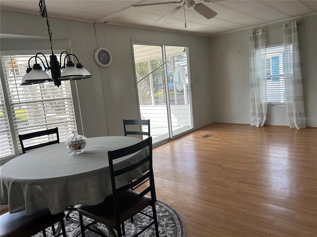 12501 Ulmerton Road, Unit 119 Largo, FL 33774 - Photo 6 of 15 a workspace with furniture window and wooden floor