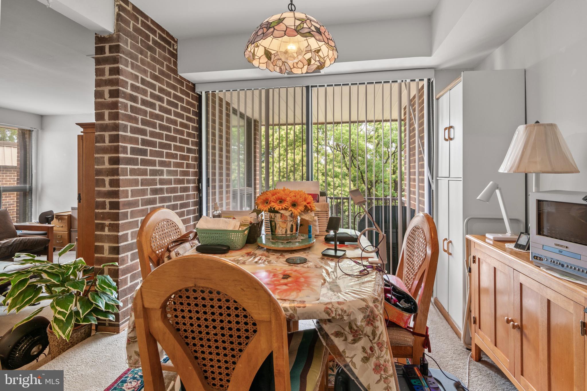 9800 Georgia Avenue, Unit 25301 Silver Spring, MD 20902 - Photo 11 of 22 a view of a dining room with furniture window and outside view
