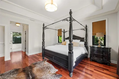 a bed room with a bed and a chandelier