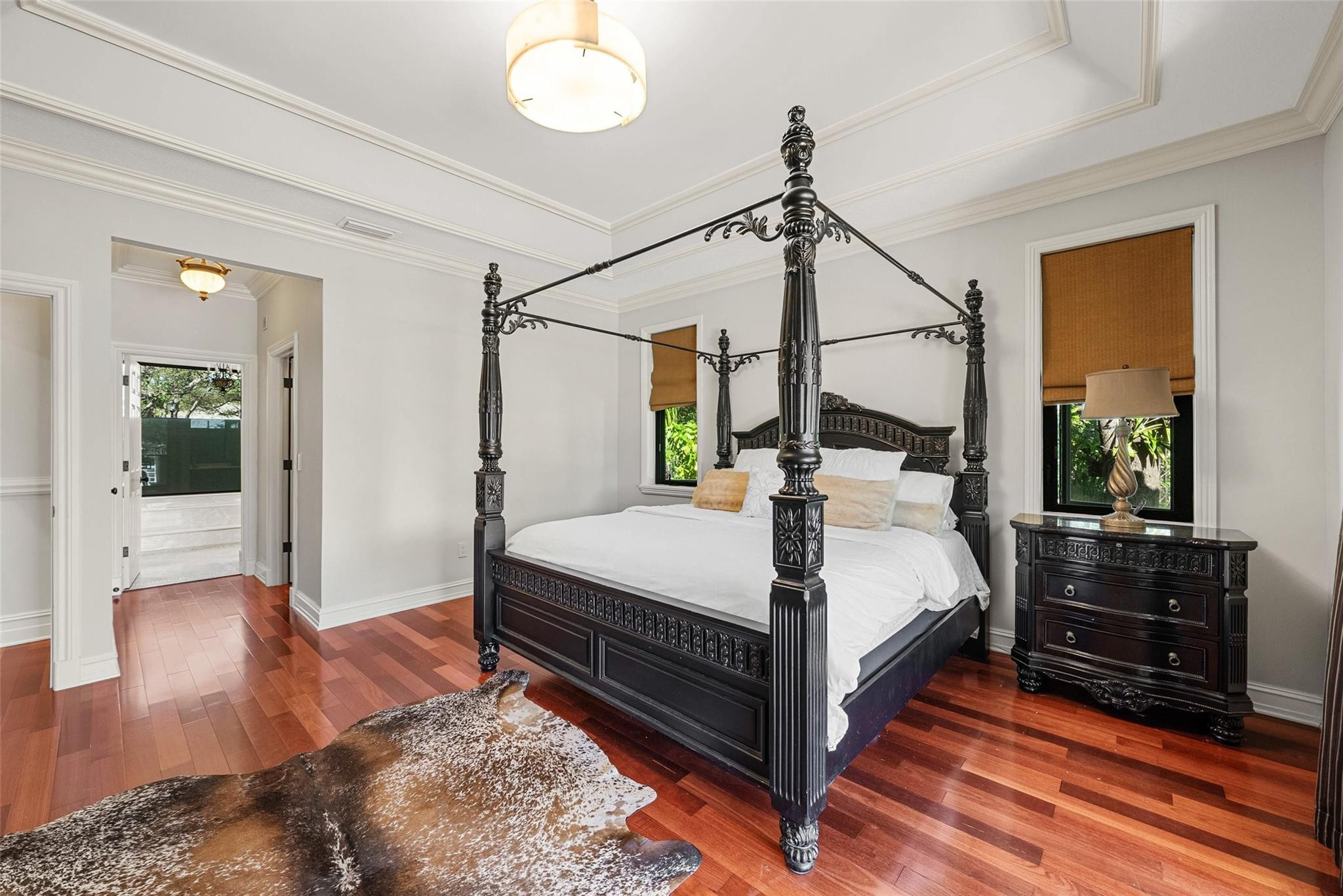 2455 Hampton Bridge Road Delray Beach, FL 33445 - Photo 15 of 46 a bed room with a bed and a chandelier