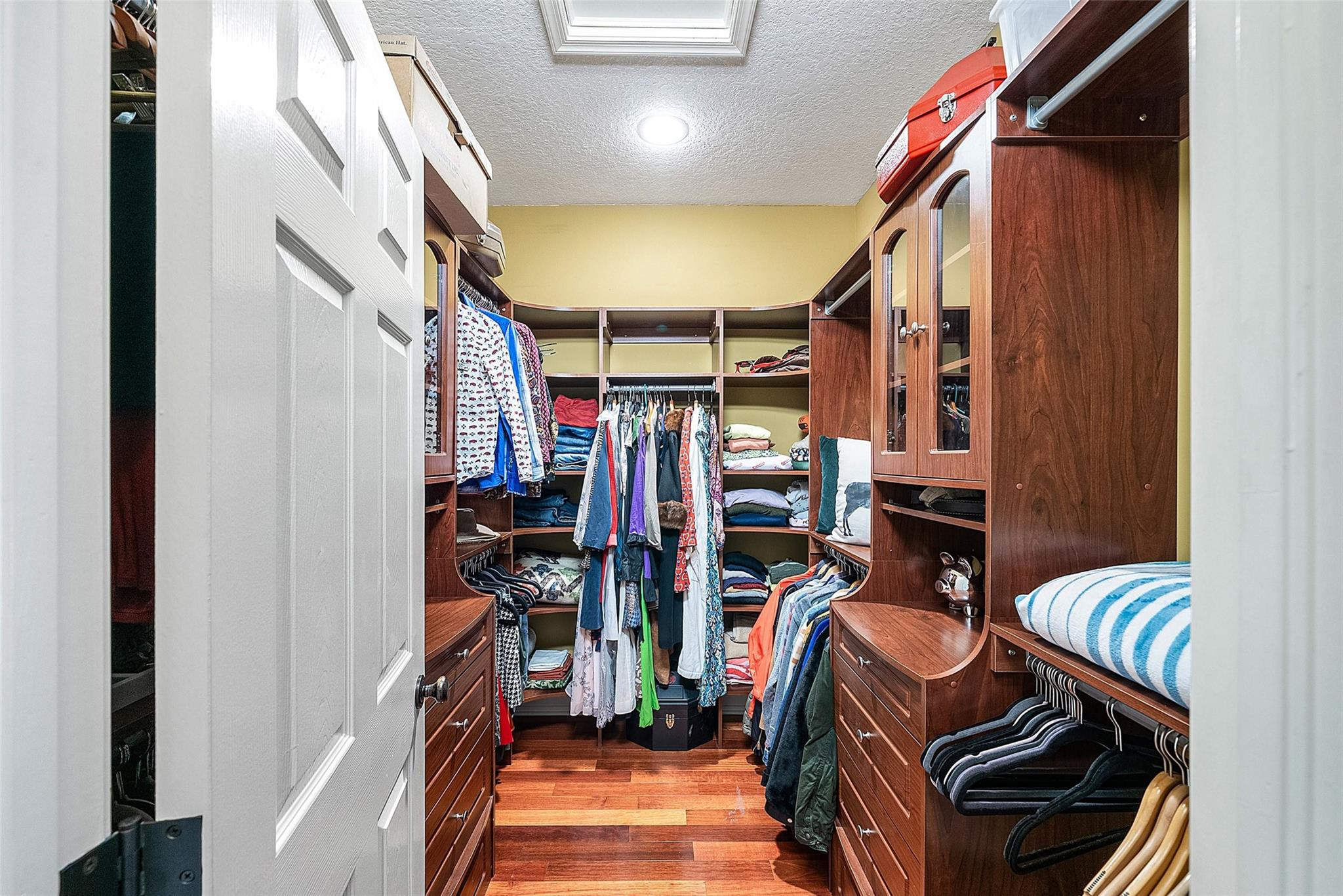 2455 Hampton Bridge Road Delray Beach, FL 33445 - Photo 17 of 46 a view of walk in closet with clothes and shoes