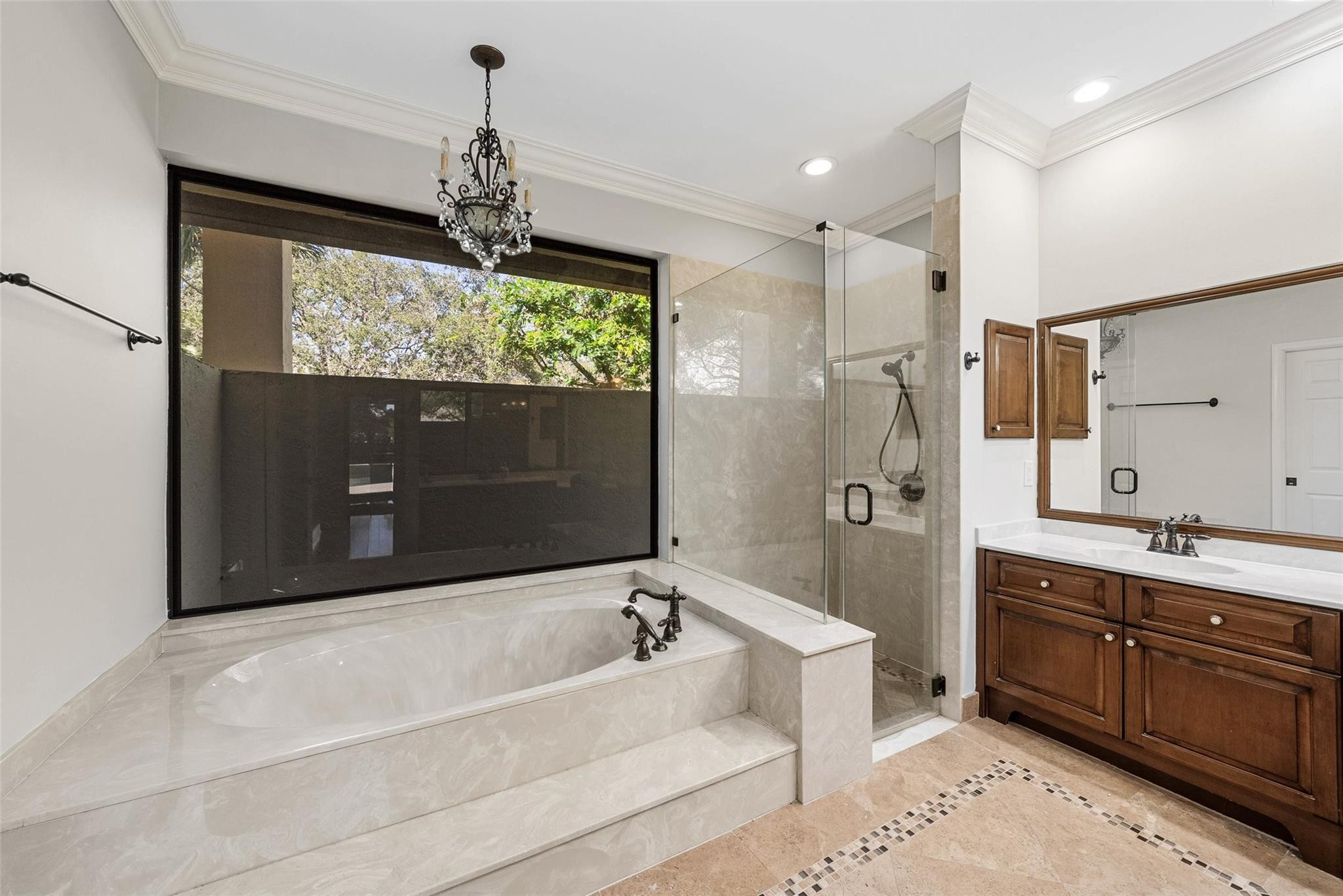 2455 Hampton Bridge Road Delray Beach, FL 33445 - Photo 19 of 46 a spacious bathroom with a tub sink shower and mirror