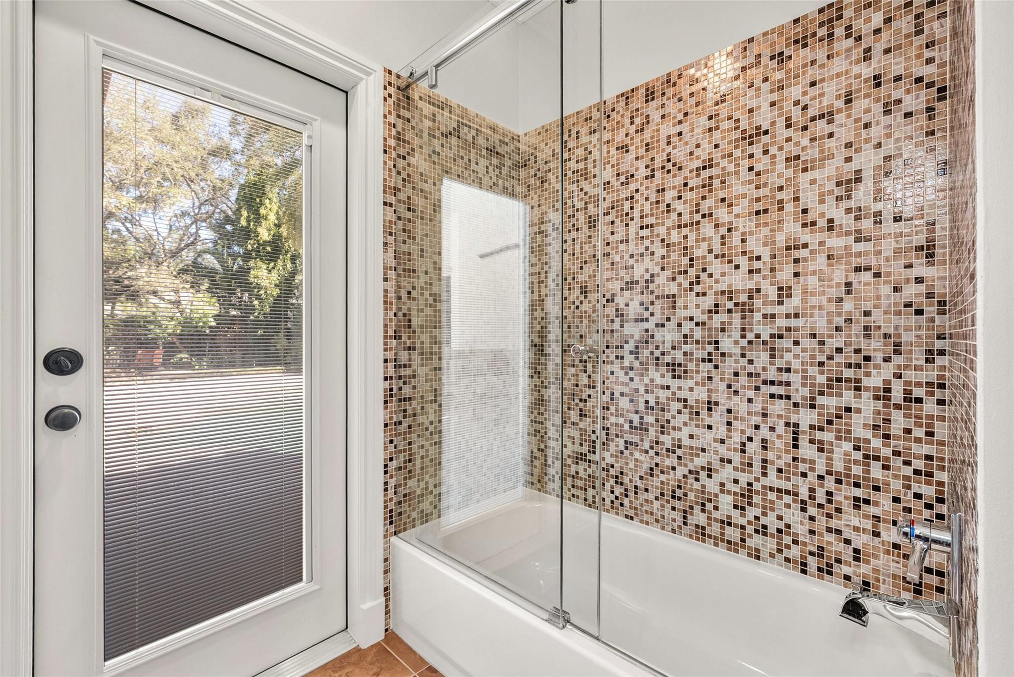 2455 Hampton Bridge Road Delray Beach, FL 33445 - Photo 25 of 46 a bathroom with a bathtub and shower